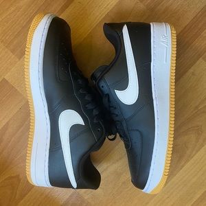 Nike Air Force 1 Low Black with gum rubber sole.